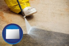 colorado map icon and pressure washing a concrete surface