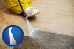 delaware map icon and pressure washing a concrete surface