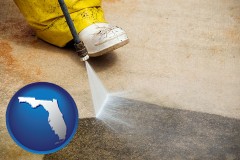 florida map icon and pressure washing a concrete surface