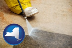 new-york map icon and pressure washing a concrete surface