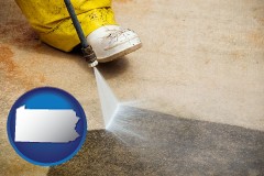 pennsylvania map icon and pressure washing a concrete surface