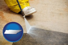 tennessee map icon and pressure washing a concrete surface