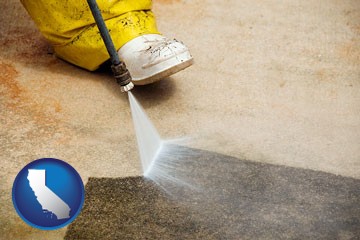 pressure washing a concrete surface - with California icon