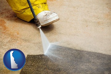pressure washing a concrete surface - with Delaware icon