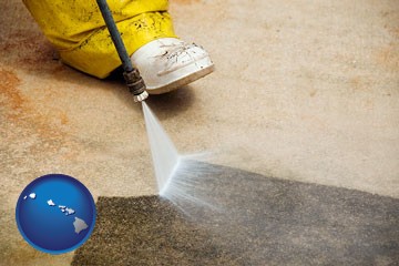 pressure washing a concrete surface - with Hawaii icon