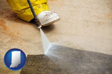 pressure washing a concrete surface - with Indiana icon