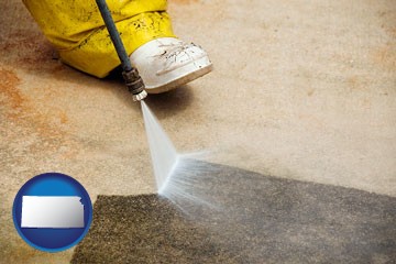 pressure washing a concrete surface - with Kansas icon