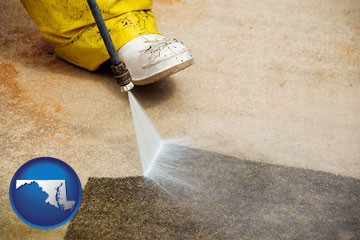 pressure washing a concrete surface - with Maryland icon