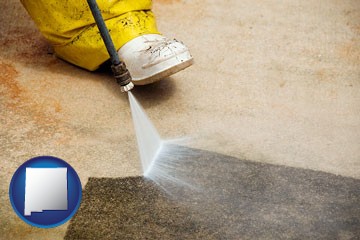 pressure washing a concrete surface - with New Mexico icon