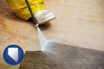 pressure washing a concrete surface - with Nevada icon