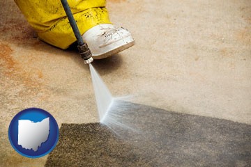 pressure washing a concrete surface - with Ohio icon