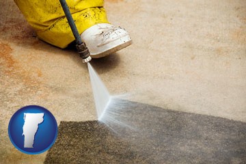 pressure washing a concrete surface - with Vermont icon