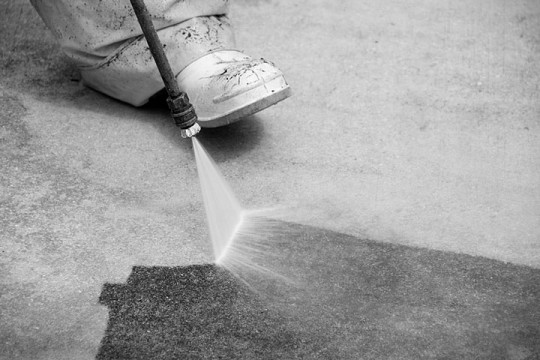 pressure washing a concrete surface