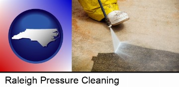 pressure washing a concrete surface in Raleigh, NC